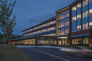 building at night with sign reading 